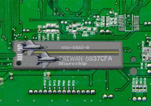 An Image of a circuit board made in Taiwan, with tiny fighter jets landing on it